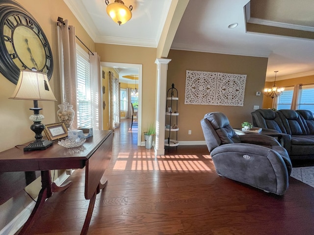 1621 Adkinson Rd, Newton, AL 36352 - living room with a chandelier, ornamental molding, wood finished floors, healthy amount of natural light, and decorative columns