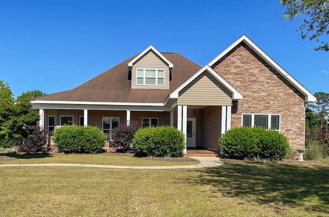 1621 Adkinson Rd, Newton, AL 36352 - view of front facade with a front lawn, stone siding, and a porch
