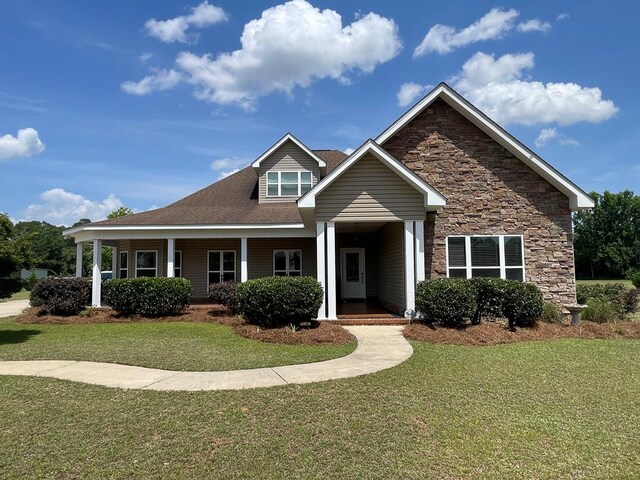 1621 Adkinson Rd, Newton, AL 36352 - view of front of home with a front lawn, stone siding, and a porch