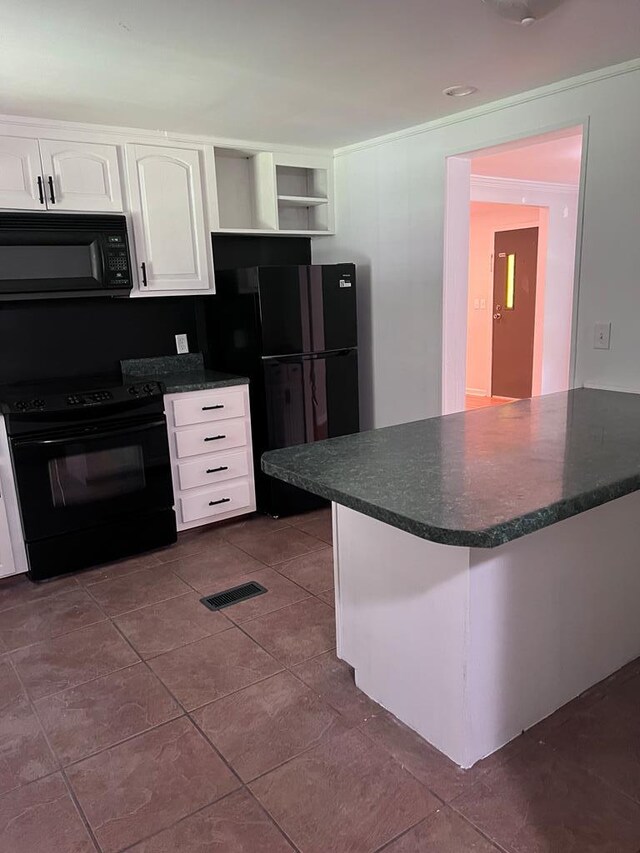 kitchen featuring black appliances, white cabinets, kitchen peninsula, and dark tile patterned flooring