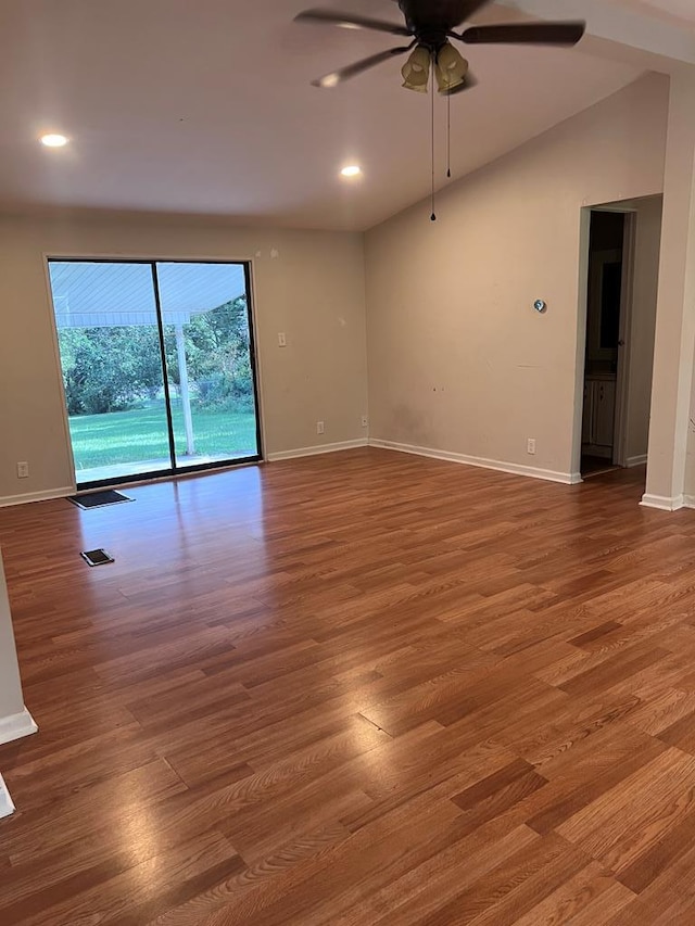 empty room featuring hardwood / wood-style floors, ceiling fan, and lofted ceiling