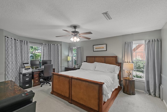 102 Lindsey Ln, Dothan, AL 36305 - bedroom featuring light colored carpet, a desk, multiple windows, ceiling fan, and a textured ceiling