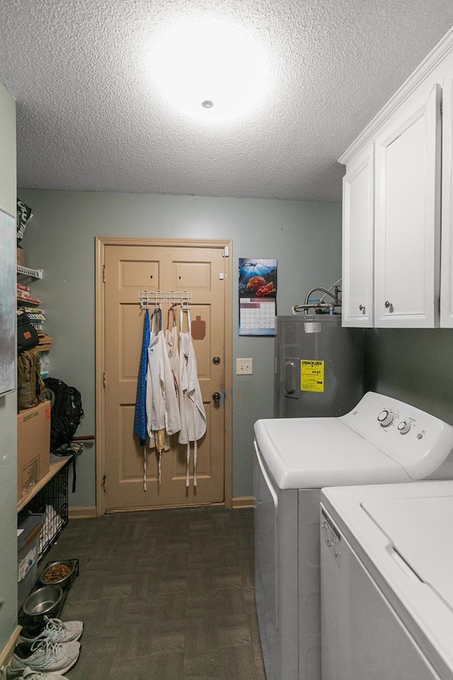 102 Lindsey Ln, Dothan, AL 36305 - washroom with water heater, cabinet space, washer and clothes dryer, a textured ceiling, and baseboards