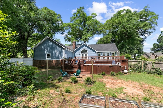 102 Lindsey Ln, Dothan, AL 36305 - back of house with a deck, a garden, and a fenced backyard