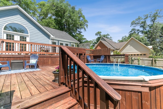 102 Lindsey Ln, Dothan, AL 36305 - view of swimming pool featuring a wooden deck and fence
