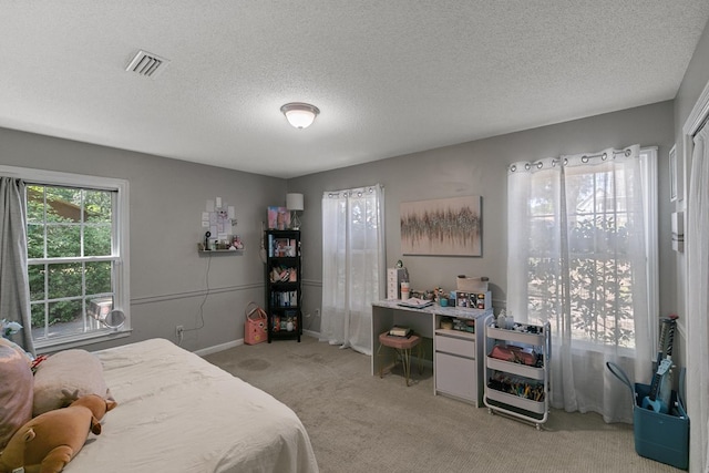 102 Lindsey Ln, Dothan, AL 36305 - carpeted bedroom featuring a textured ceiling