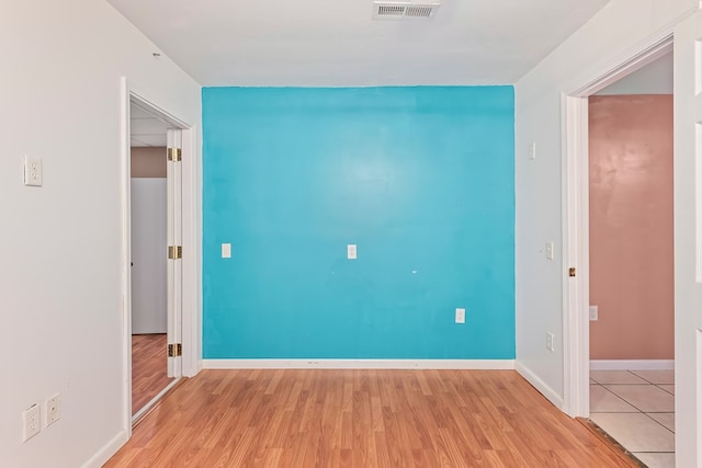 unfurnished room featuring light hardwood / wood-style flooring