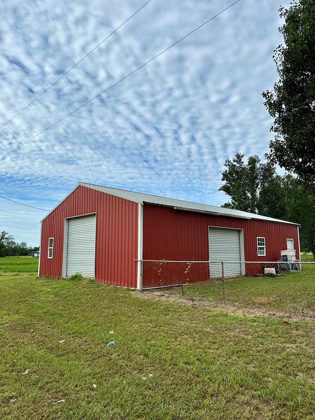 view of outbuilding with a lawn