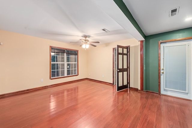 spare room featuring ceiling fan and light hardwood / wood-style flooring