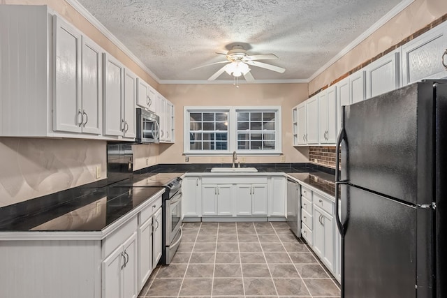 kitchen featuring ceiling fan, sink, crown molding, white cabinets, and appliances with stainless steel finishes