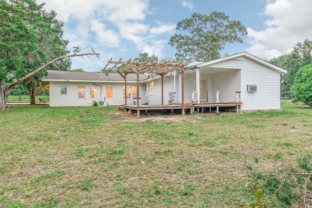 back of house with a pergola and a yard