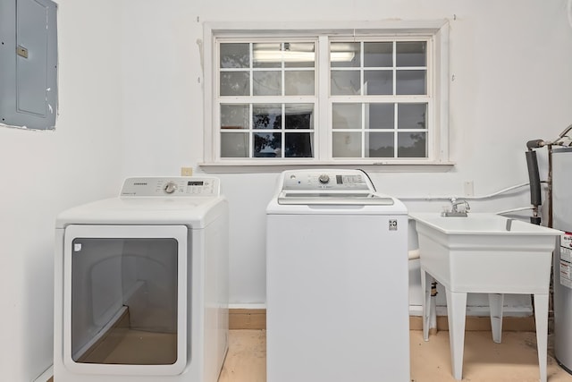 laundry room with washer and clothes dryer and electric panel