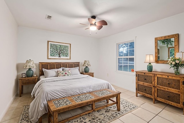 bedroom with ceiling fan and light tile patterned floors