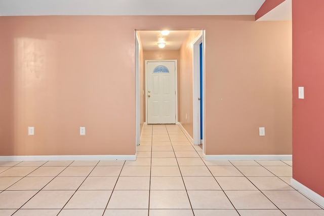 corridor with light tile patterned flooring