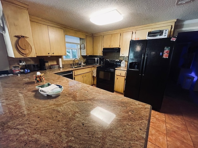 kitchen with black appliances, light brown cabinets, light tile patterned floors, and sink