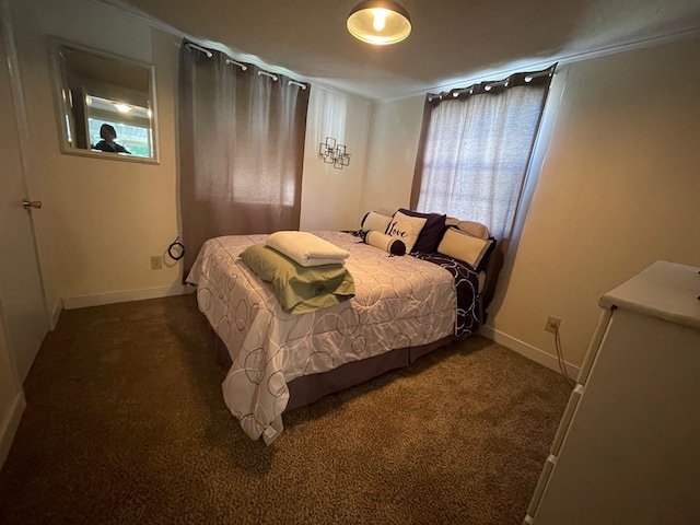 bedroom with dark colored carpet