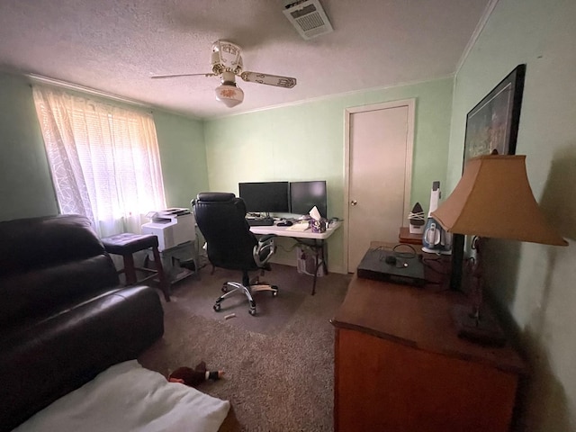 office featuring carpet flooring, ceiling fan, ornamental molding, and a textured ceiling