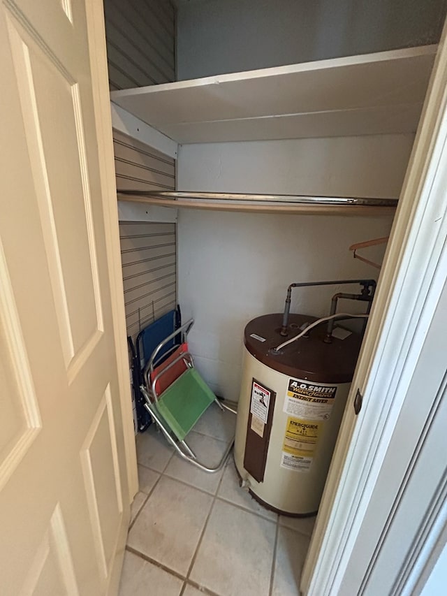 utility room featuring water heater