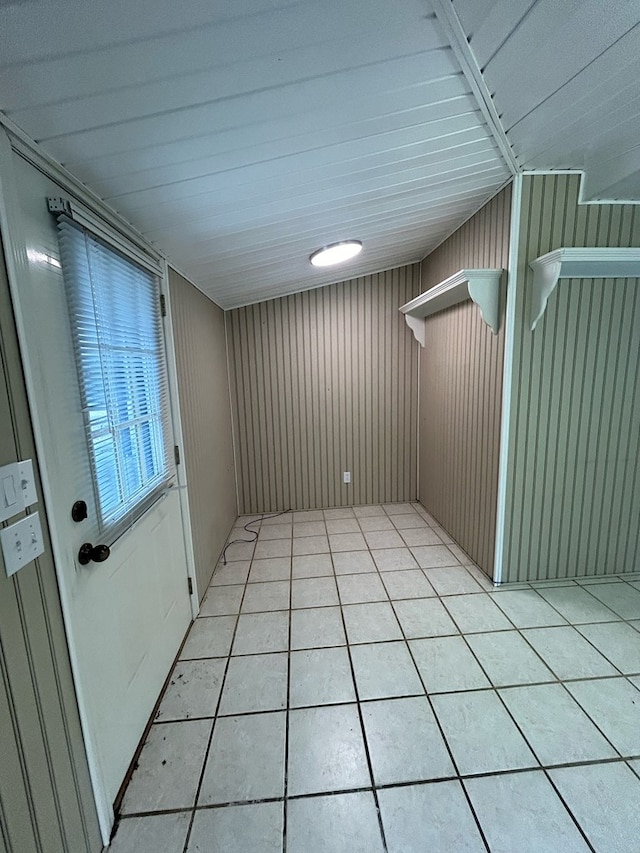 tiled spare room with wooden walls