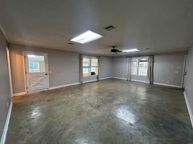 unfurnished room featuring plenty of natural light and ceiling fan