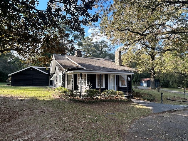 view of front of home with an outbuilding and a garage