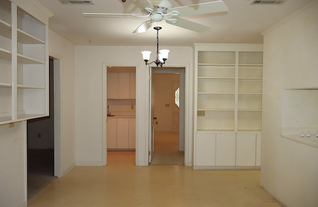 unfurnished dining area featuring ceiling fan with notable chandelier