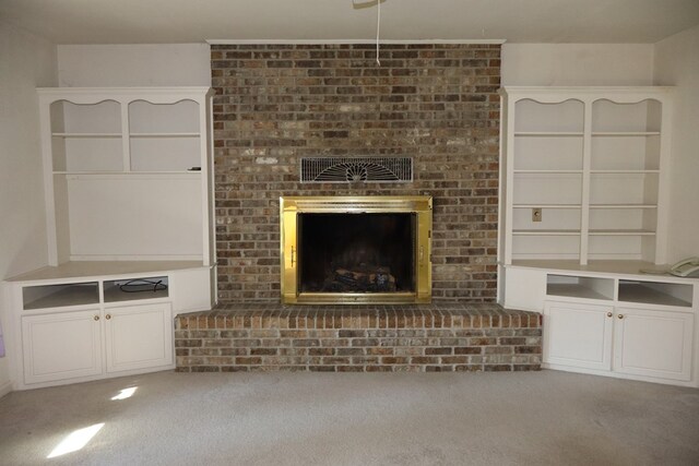 unfurnished living room featuring a fireplace and carpet floors