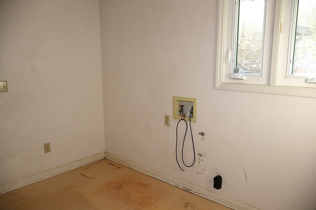 washroom featuring light colored carpet and washer hookup