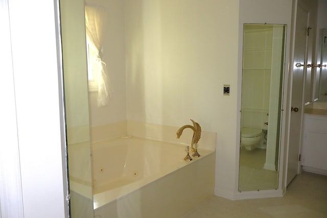 bathroom featuring a bathtub and toilet