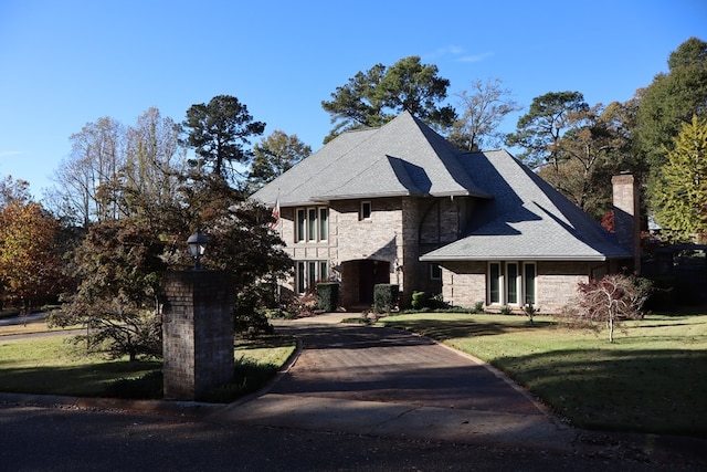 view of front of property with a front lawn