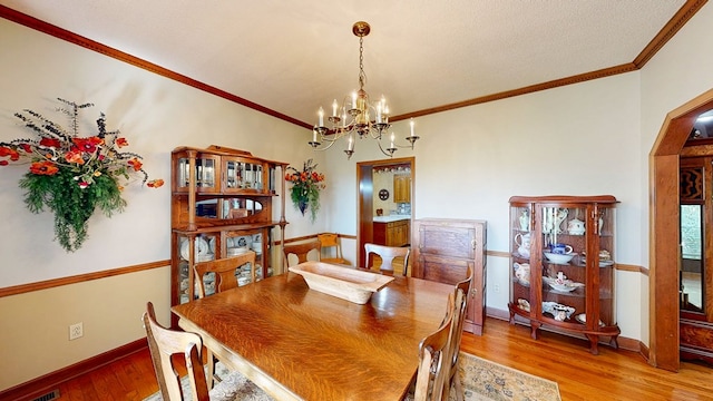 1109 Sanitary Dairy Rd, Cowarts, AL 36321 - dining area with baseboards, a chandelier, crown molding, and light wood finished floors