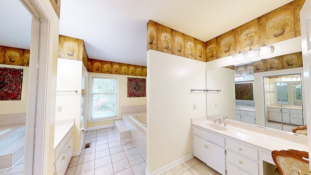 1109 Sanitary Dairy Rd, Cowarts, AL 36321 - bathroom featuring a bath, baseboards, two vanities, a sink, and tile patterned flooring