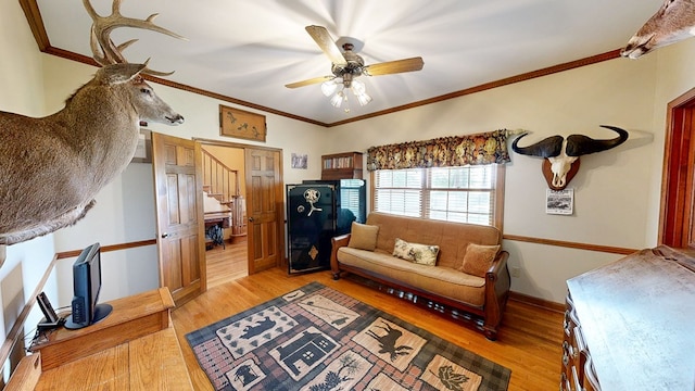 1109 Sanitary Dairy Rd, Cowarts, AL 36321 - living area featuring stairway, light wood-style floors, ornamental molding, and a ceiling fan