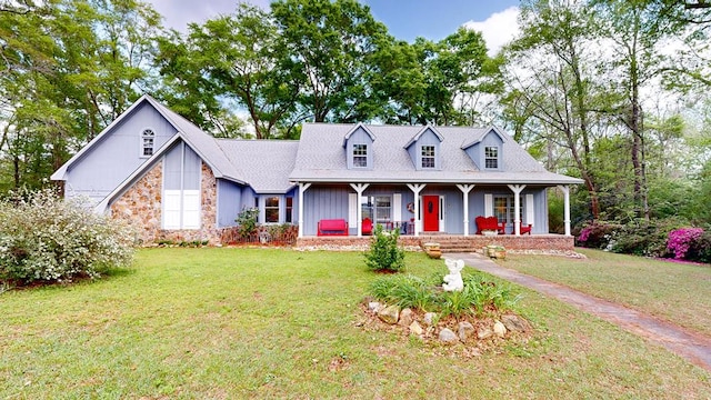 1109 Sanitary Dairy Rd, Cowarts, AL 36321 - cape cod-style house featuring a front yard, stone siding, and a porch