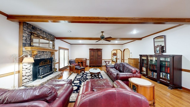 1109 Sanitary Dairy Rd, Cowarts, AL 36321 - living area featuring ceiling fan, wood finished floors, beamed ceiling, and a stone fireplace