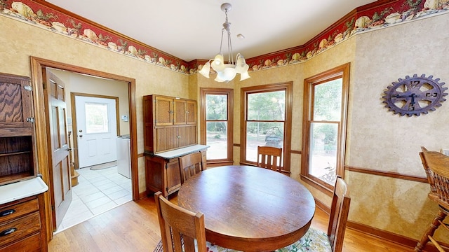 1109 Sanitary Dairy Rd, Cowarts, AL 36321 - dining space featuring a notable chandelier and light wood-type flooring