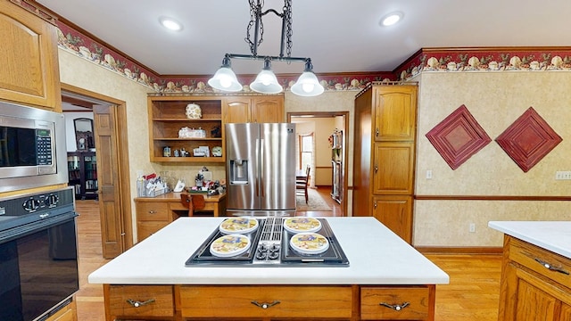 1109 Sanitary Dairy Rd, Cowarts, AL 36321 - kitchen featuring light countertops, open shelves, wallpapered walls, light wood-style flooring, and appliances with stainless steel finishes