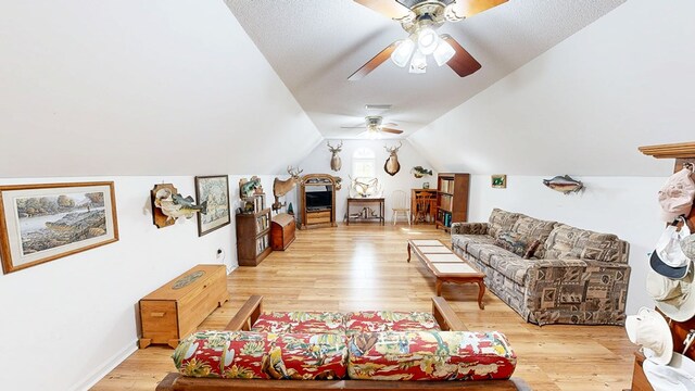 1109 Sanitary Dairy Rd, Cowarts, AL 36321 - living room with light wood-style flooring, vaulted ceiling, and ceiling fan