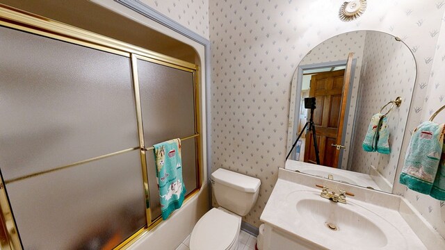 1109 Sanitary Dairy Rd, Cowarts, AL 36321 - full bathroom featuring combined bath / shower with glass door, wallpapered walls, toilet, and vanity