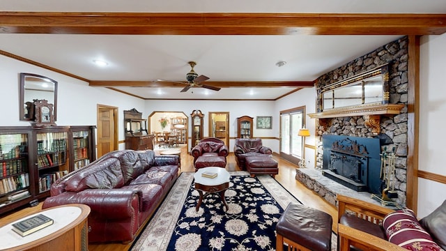 1109 Sanitary Dairy Rd, Cowarts, AL 36321 - living room with a fireplace, wood finished floors, beamed ceiling, ceiling fan, and ornamental molding