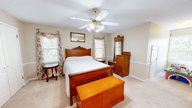 1109 Sanitary Dairy Rd, Cowarts, AL 36321 - bedroom featuring baseboards, a textured ceiling, ceiling fan, and light colored carpet
