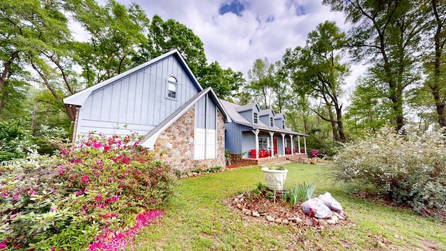 1109 Sanitary Dairy Rd, Cowarts, AL 36321 - back of property featuring stone siding and a lawn
