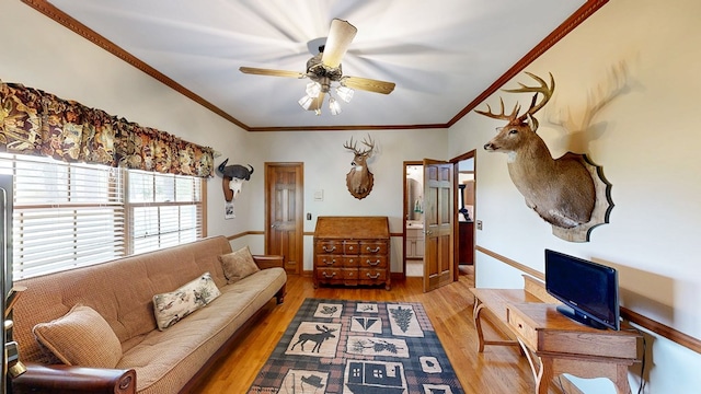 1109 Sanitary Dairy Rd, Cowarts, AL 36321 - living area with baseboards, wood finished floors, ornamental molding, and a ceiling fan