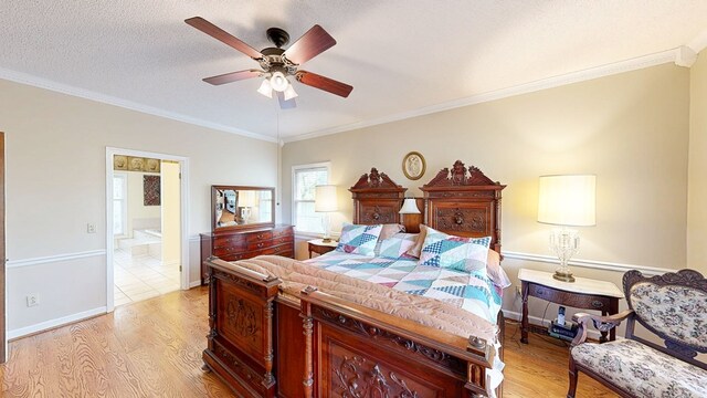 1109 Sanitary Dairy Rd, Cowarts, AL 36321 - bedroom with a textured ceiling, ornamental molding, baseboards, and light wood-type flooring