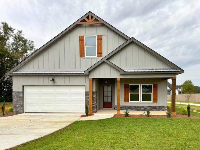 craftsman inspired home with a front yard and a garage