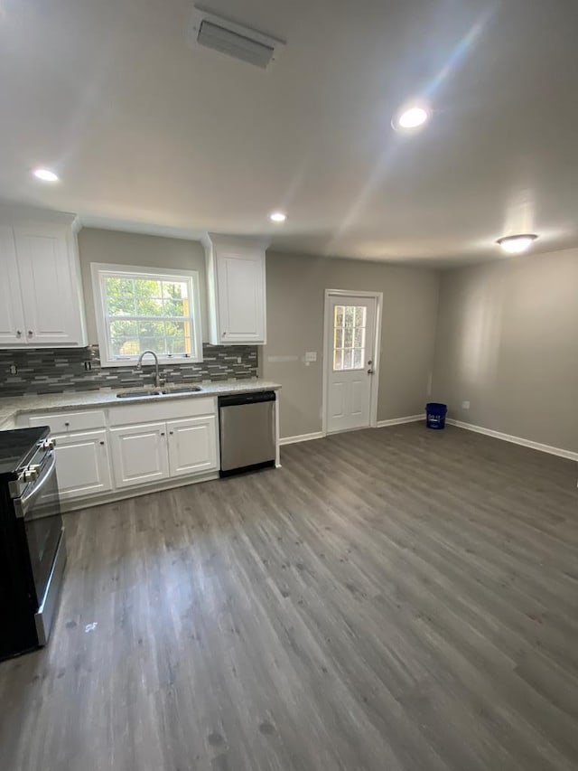 kitchen featuring white cabinets, hardwood / wood-style flooring, sink, and appliances with stainless steel finishes