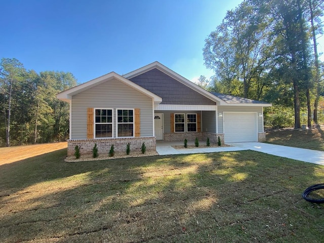 craftsman-style home featuring covered porch, a garage, and a front lawn