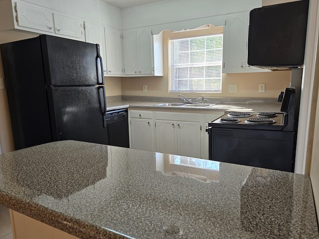 kitchen with black appliances, a peninsula, a sink, and white cabinets