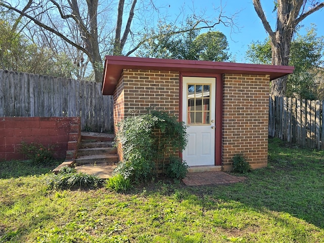 view of shed with fence private yard