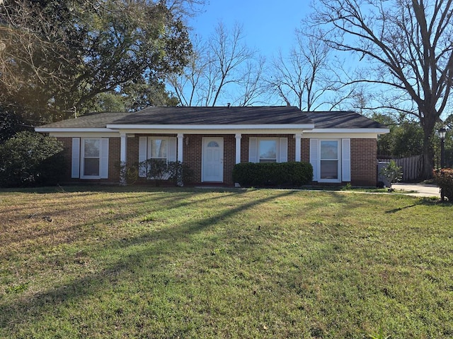 single story home with brick siding and a front yard